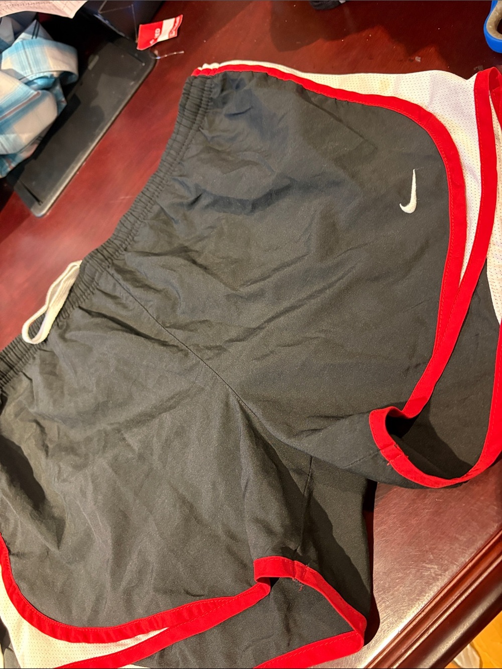 Nike Men’s Black Athletic Shorts with Red Trim and White Swoosh